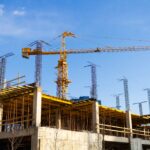 crane-and-building-under-construction-on-a-sunny-d-2026-03-16-02-12-26-utc