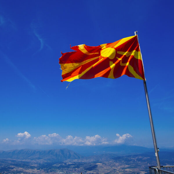 red-and-yellow-flag-waving-against-blue-sky-2026-01-11-09-46-27-utc