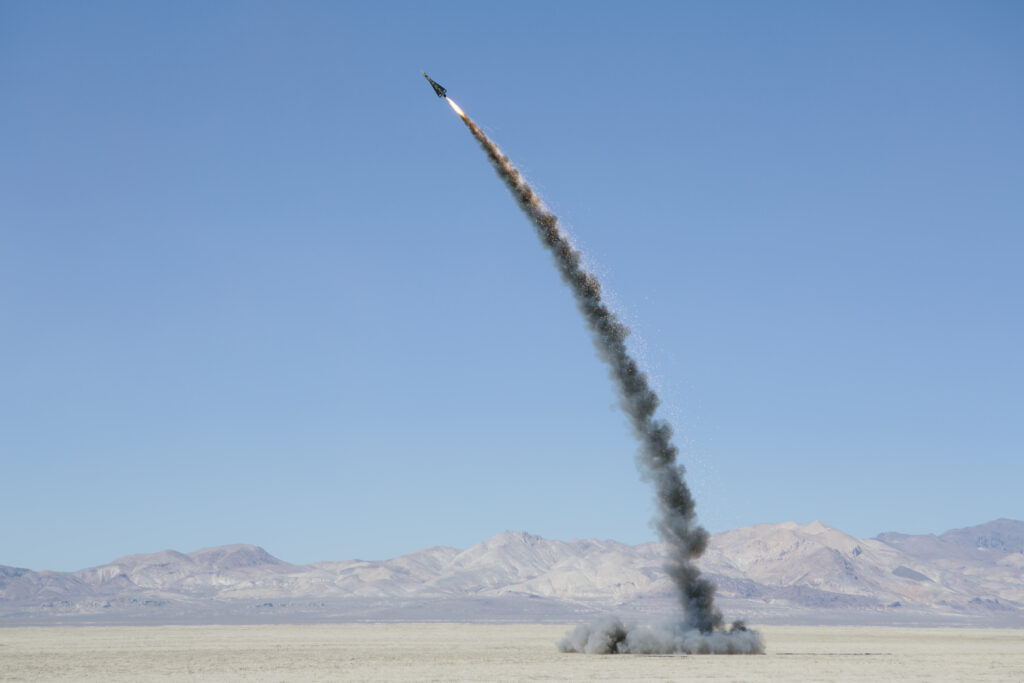 Rocket shooting into vast, desert sky, Black Rock Desert, Nevada,Rocket shooting into vast, desert sky, Black Rock Desert, Nevada,USA