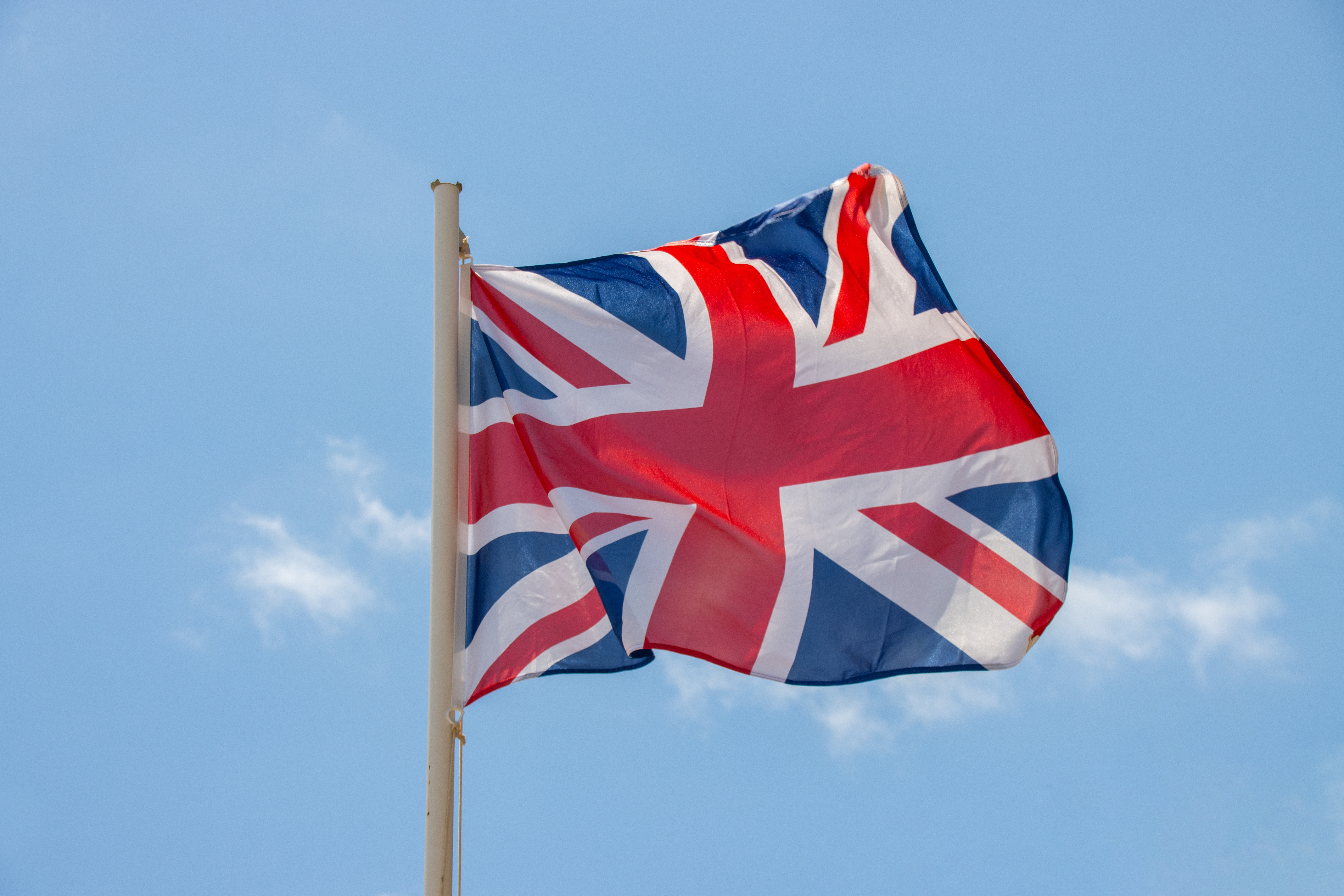 union-jack-flag-against-a-clear-sky-backdrop-2026-04-15-05-26-55-utc
