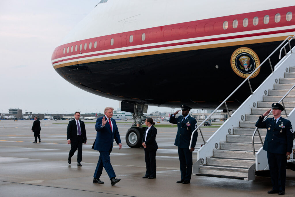 U.S. President Donald Trump boards Air Force One, en route to Joint Base Andrews, in Cleveland