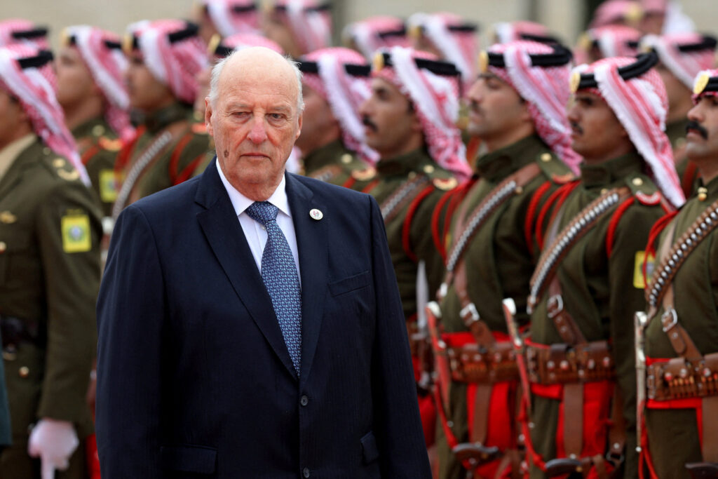 FILE PHOTO: Norway’s King Harald V reviews an honor guard at the Royal Palace in Amman