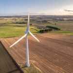 a-wind-turbine-in-a-field-used-for-renewable-energ-2026-03-17-05-05-39-utc