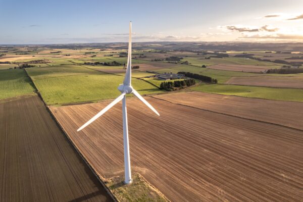 a-wind-turbine-in-a-field-used-for-renewable-energ-2026-03-17-05-05-39-utc