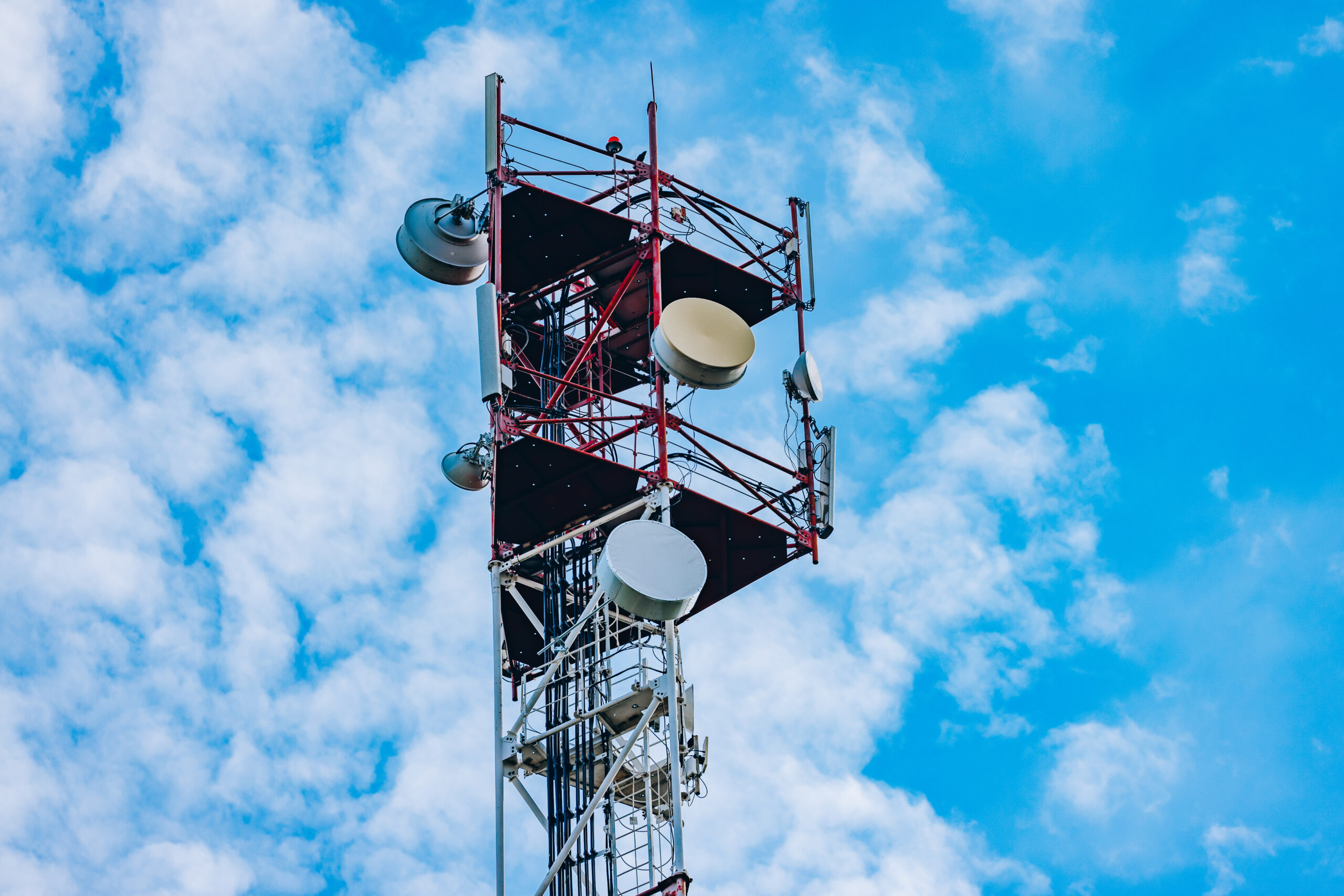 Aerial drone view of 5G telecommunication tower. Cell phone towe
