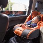 Mother and Baby,Japan,A mother and her young baby boy in a car.