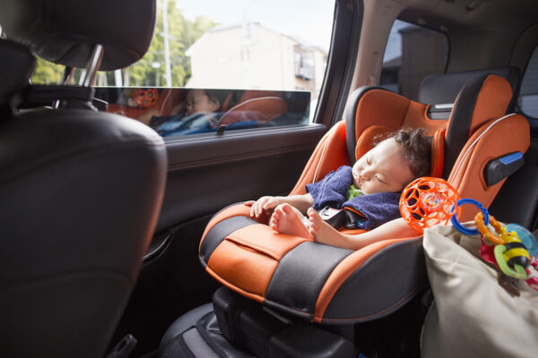 Mother and Baby,Japan,A mother and her young baby boy in a car.