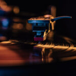 Classic vinyl record, turntable spin, analog sound, music concept. Retro vibes.