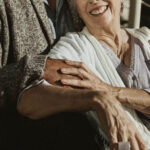 Happy romantic senior couple spending time together on the pier