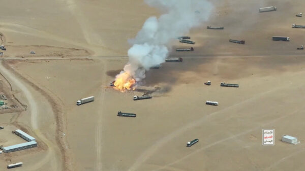 Smoke rises from trucks, near Al-Wadiah