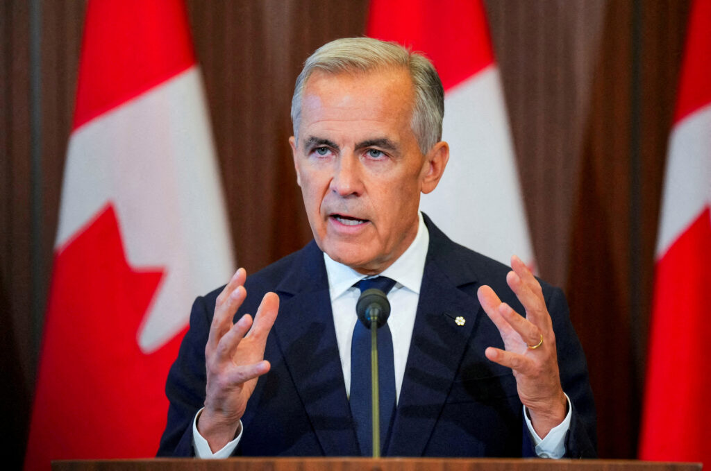 FILE PHOTO: FILE PHOTO: Canada’s Prime Minister Mark Carney suspends trade negotiations with the U.S.