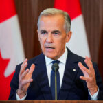 FILE PHOTO: FILE PHOTO: Canada’s Prime Minister Mark Carney suspends trade negotiations with the U.S.