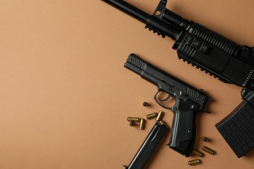 assault-rifle-with-handgun-on-brown-surface-2026-03-25-03-13-05-utc