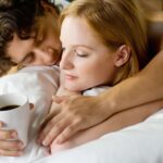 couple-embracing-in-bed-with-coffee-2026-01-05-23-33-01-utc